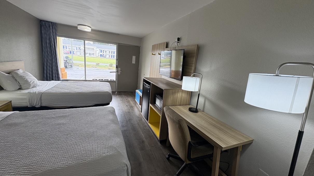 In-room amenities including flat screen TV and work desk area