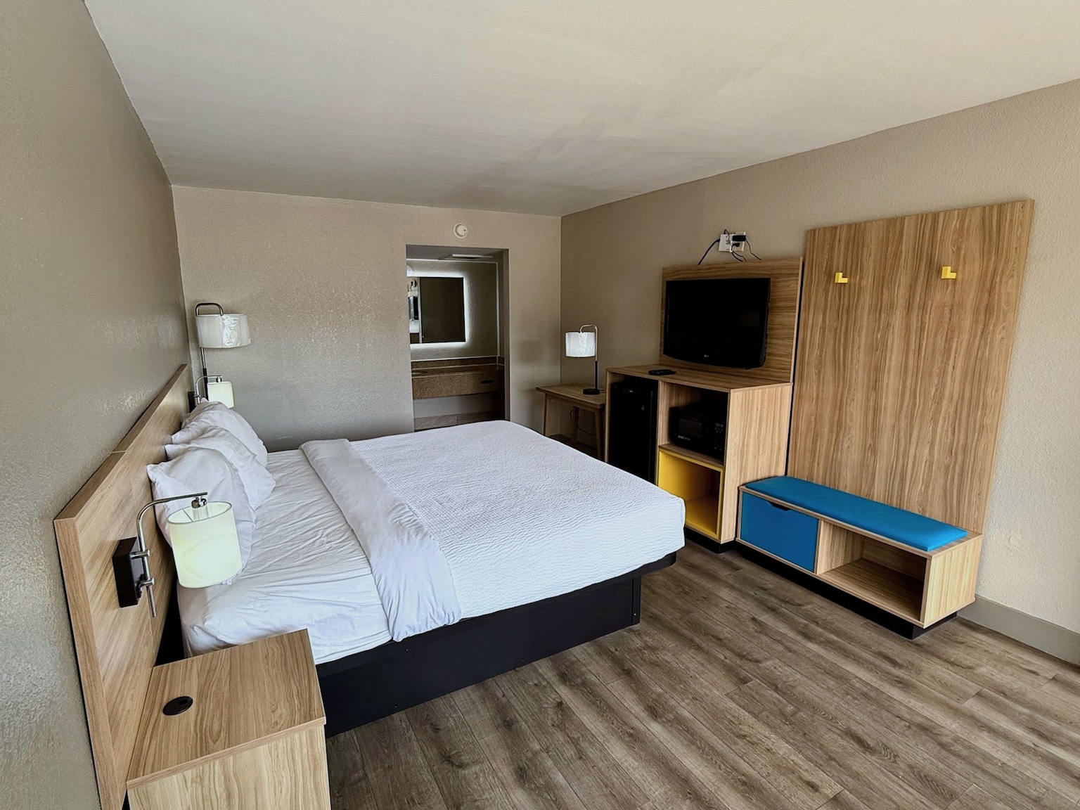 King bed guest room with work desk, suitable for business travelers on I-95